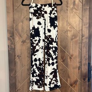 Daytrip Cowprint flare bottom pants youth medium from Buckle.   Fit likes 8-10.